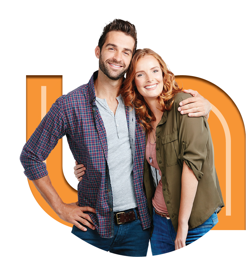 A casually dressed couple stands close together, smiling against a vibrant circular background.